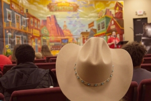 Cowboy hat views the stage.